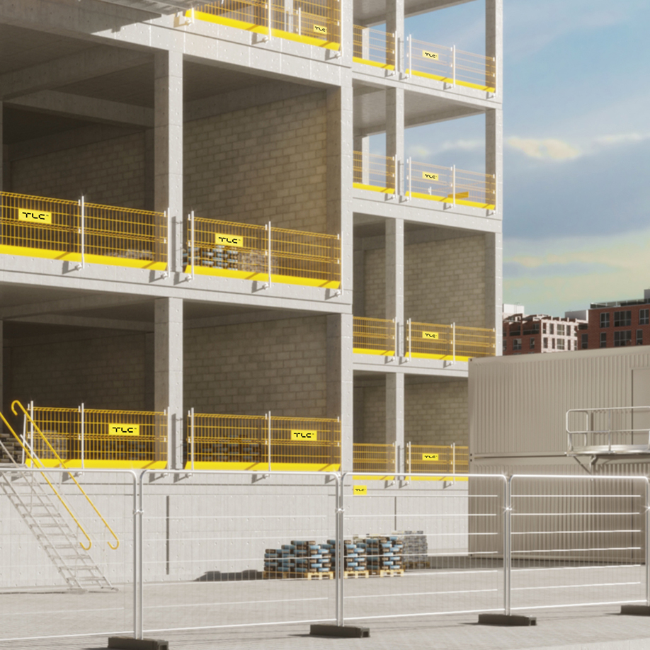 building site with yellow EPS edge protection, TAS steel stairs, and Mobilt temporary fencing panels.